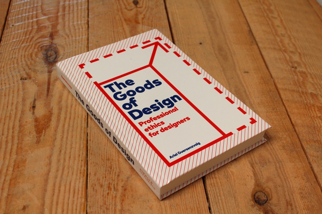 Image depicting a hard cover book titled "The Goods of Design: Professional ethics for designers" by Ariel Guersenzvaig. The book has a clean and modern design with a red and blue geometric cover on a wooden background.